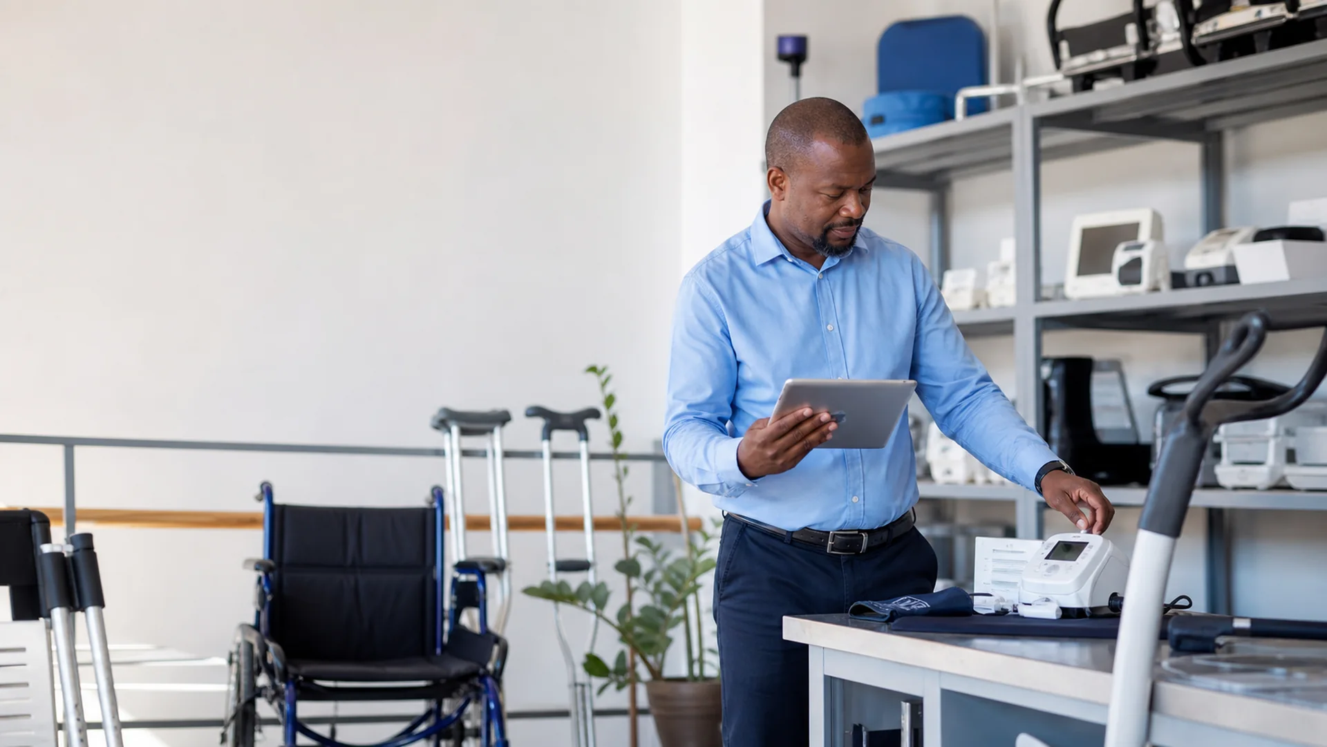 Nigerian medical equipment specialist reviewing suitable healthcare products